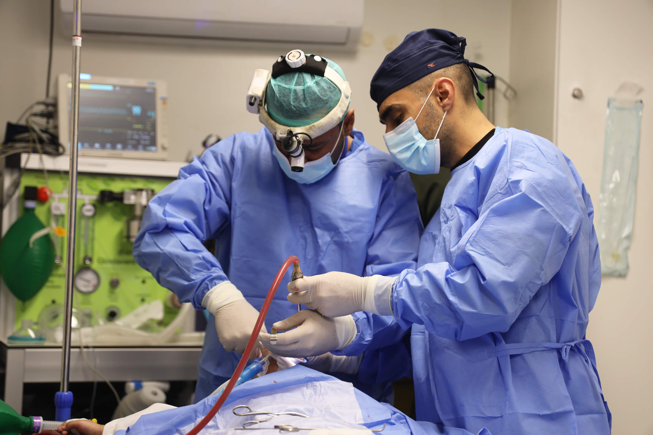 Doctors perform surgery in one of International Medical Corps’ three field hospitals in Gaza.
