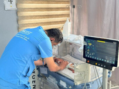 One of Amal’s twins, Wateen, receives respiratory support at the field hospital in Deir Al-Balah.