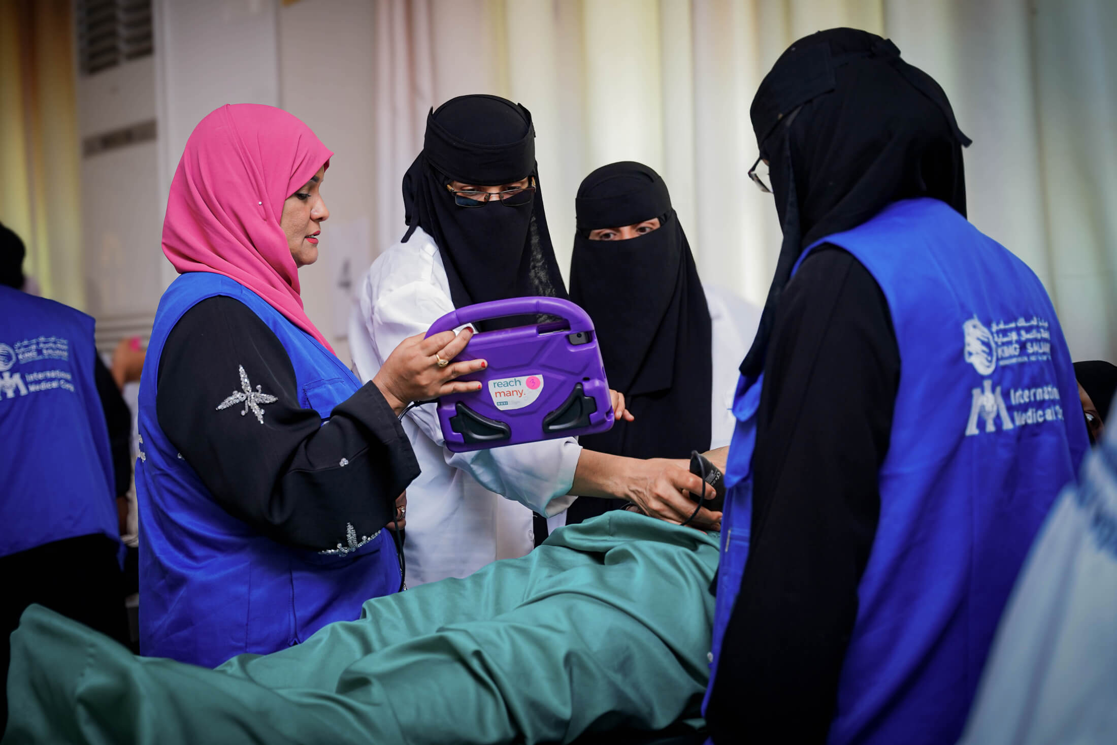 Yemeni health workers scan a pregnant woman during a training on point-of-care ultrasound in Aden district.