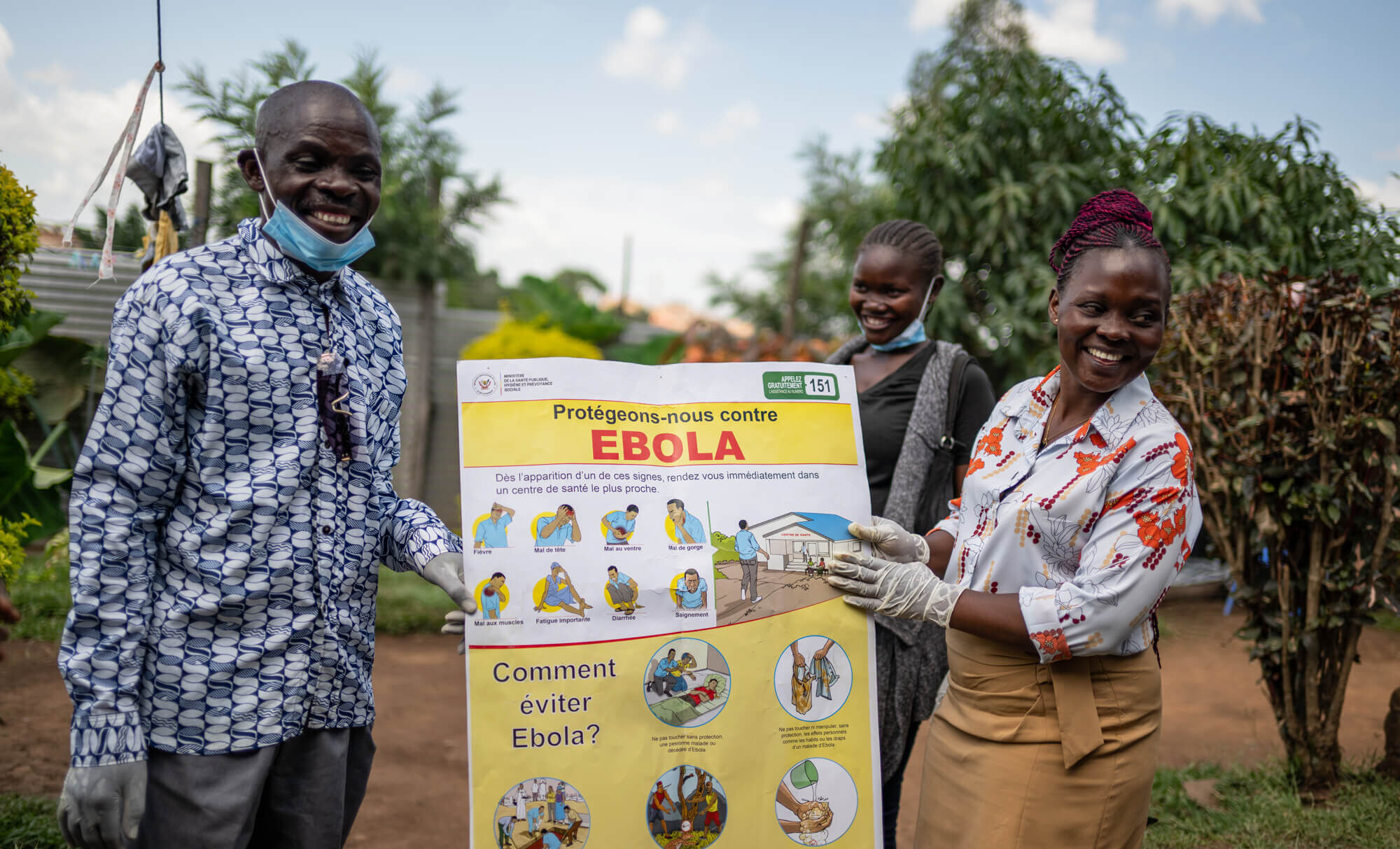 Community health workers conduct door-to-door awareness sessions on the prevention and symptoms of Ebola for a household in Bunia, Ituri.