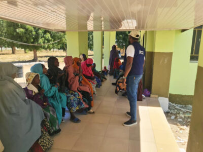 Anthony Daniel and a group of patients at the hospital’s waiting area during an awareness raising event.