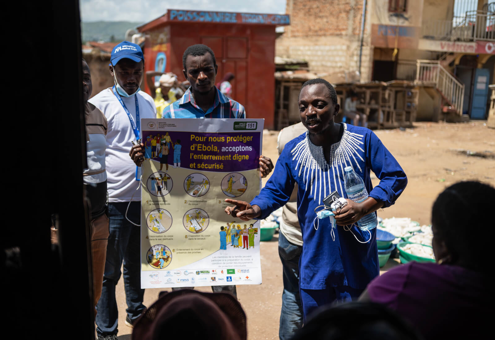 An International Medical Corps community health educator shares Ebola prevention information with the community in Bunia.