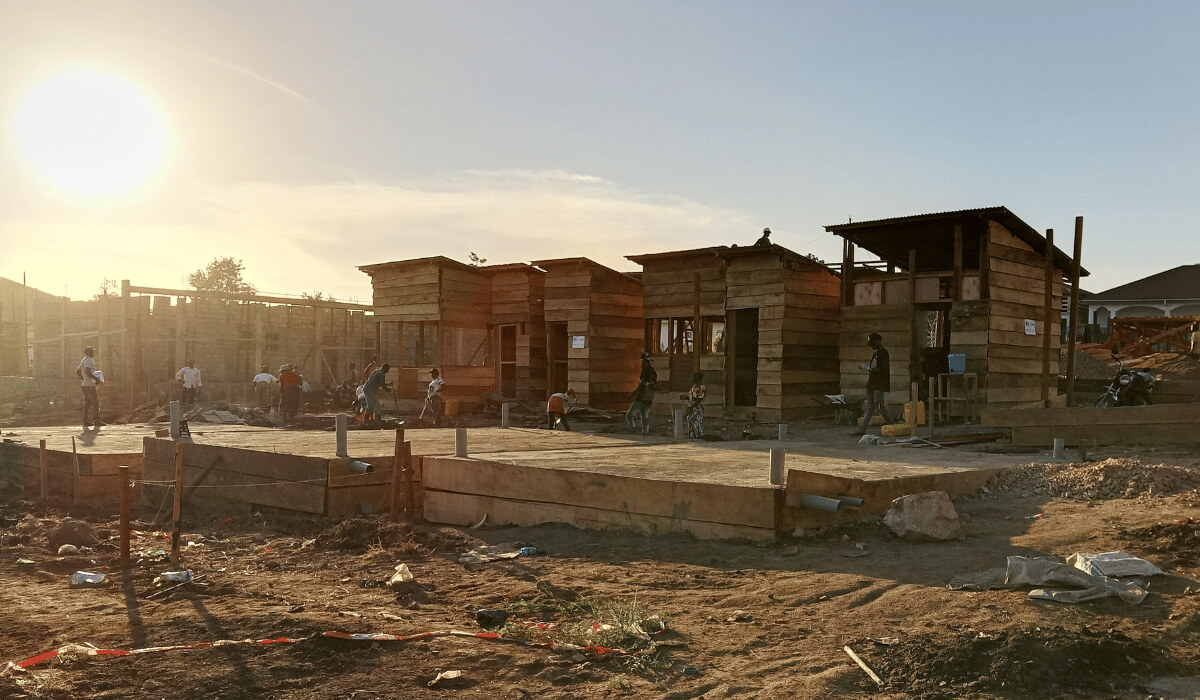 Builders construct International Medical Corps treatment and screening units in Bunia, Ituri, DRC.