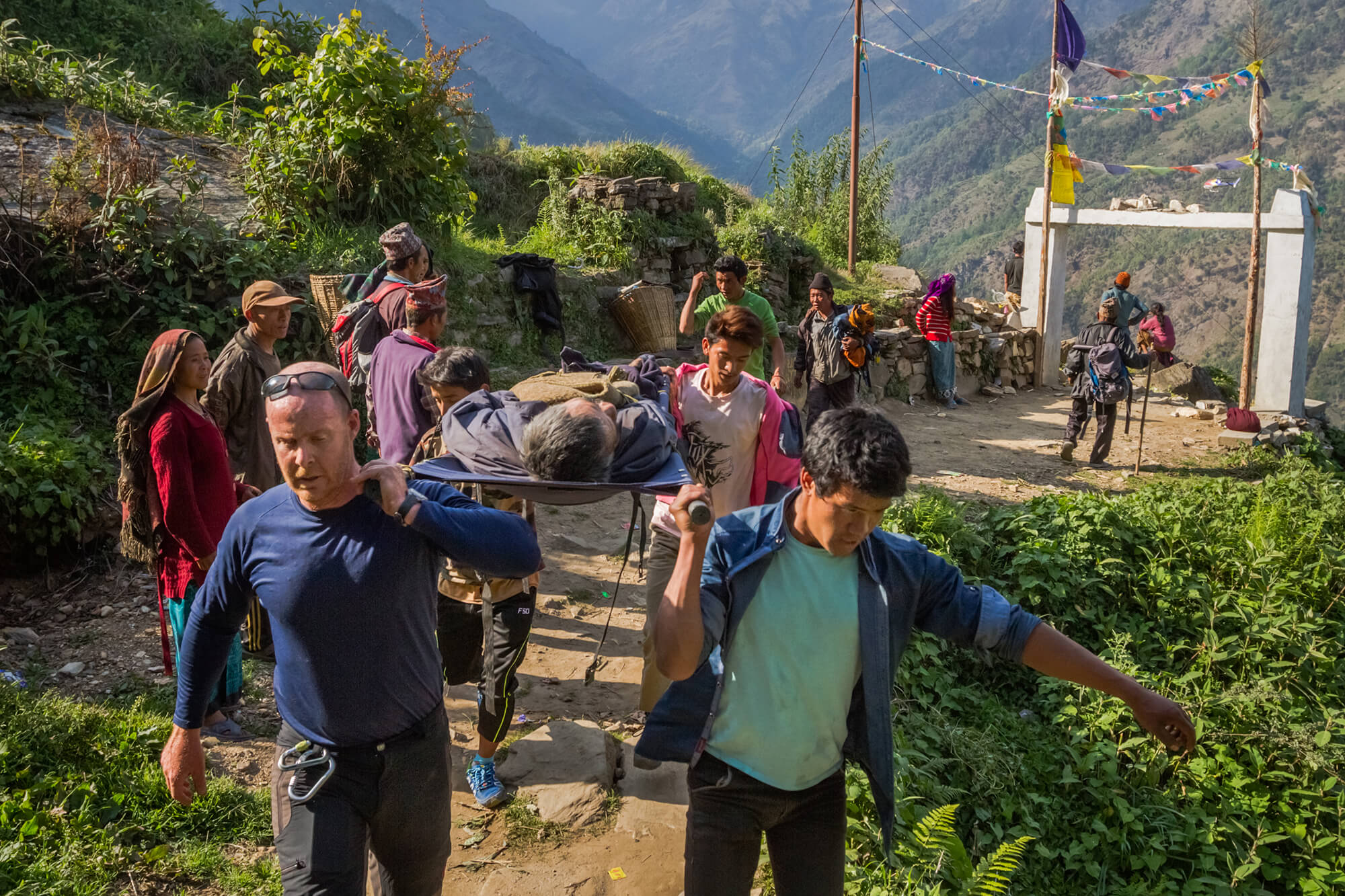 MD Michael Karch and a team of local villagers had to climb some 3,000 feet to Laprak, to evacuate Madhira Singh to the Gorkha District Hospital. Singh had been trapped under his home for two days and without medical attention for nine days after the earthquake in April 2015.
