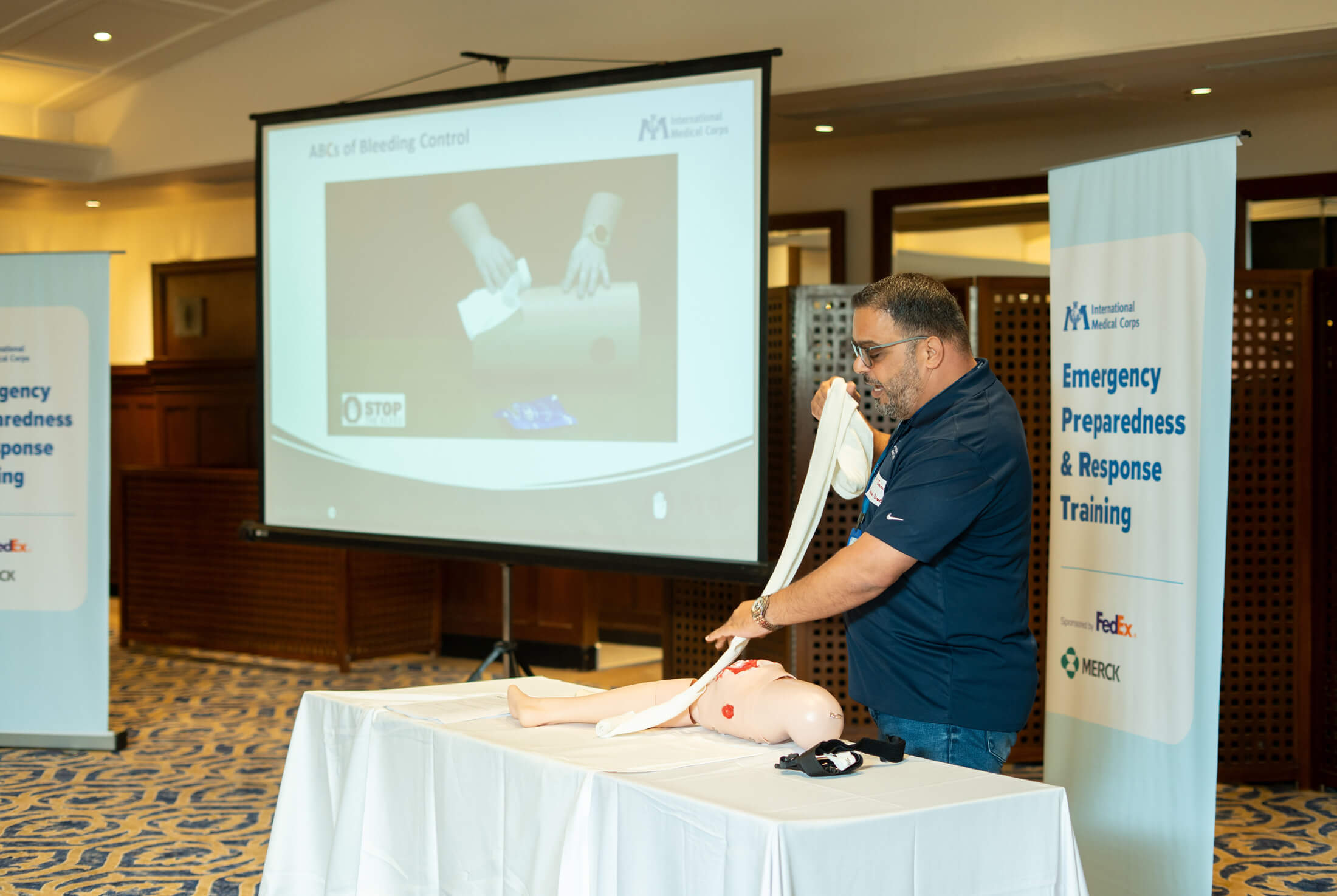 During an STB session, ERU team member Jalal Abbous demonstrates how to compress and pack a wound.