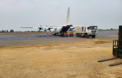 A plane carrying PPE supplies sits on the runway at Bunia Airport.