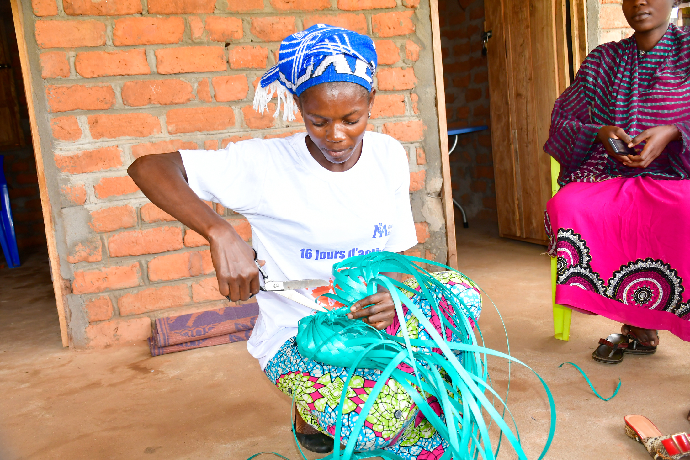 A woman participates in an International Medical Corps skill-building workshop in the DRC.