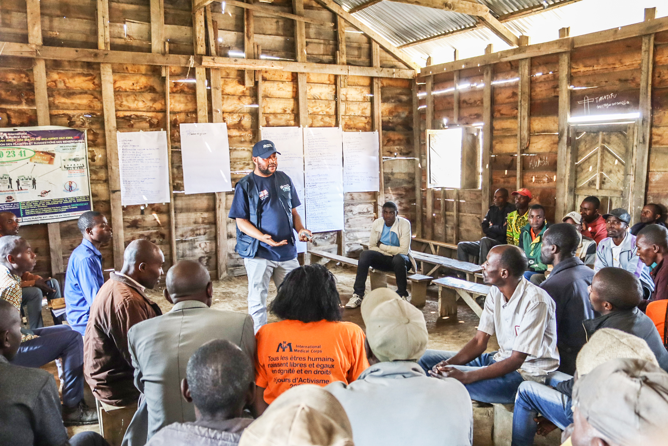 Patrick Lunyanya Shenkuru leads a reflection session with men in Kashebere, helping them to identify the causes and consequences of VAWG and develop practical strategies to prevent and respond to it in their communities.