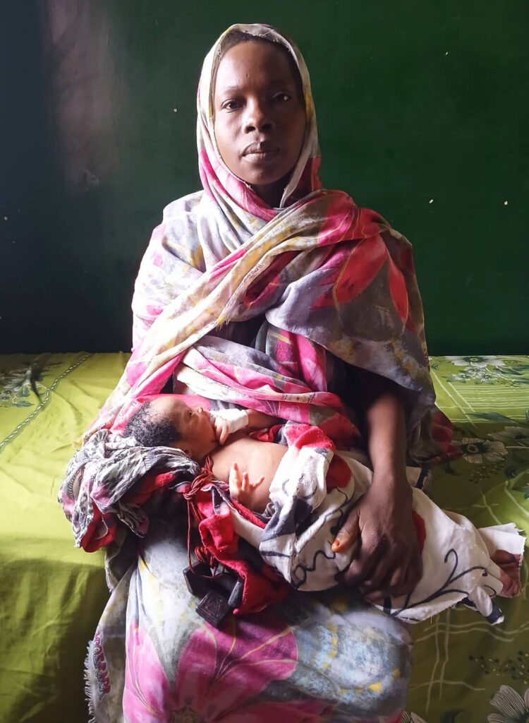Fathia with her newborn son, Omran, after recovering at Shangil Tobaya Hospital.