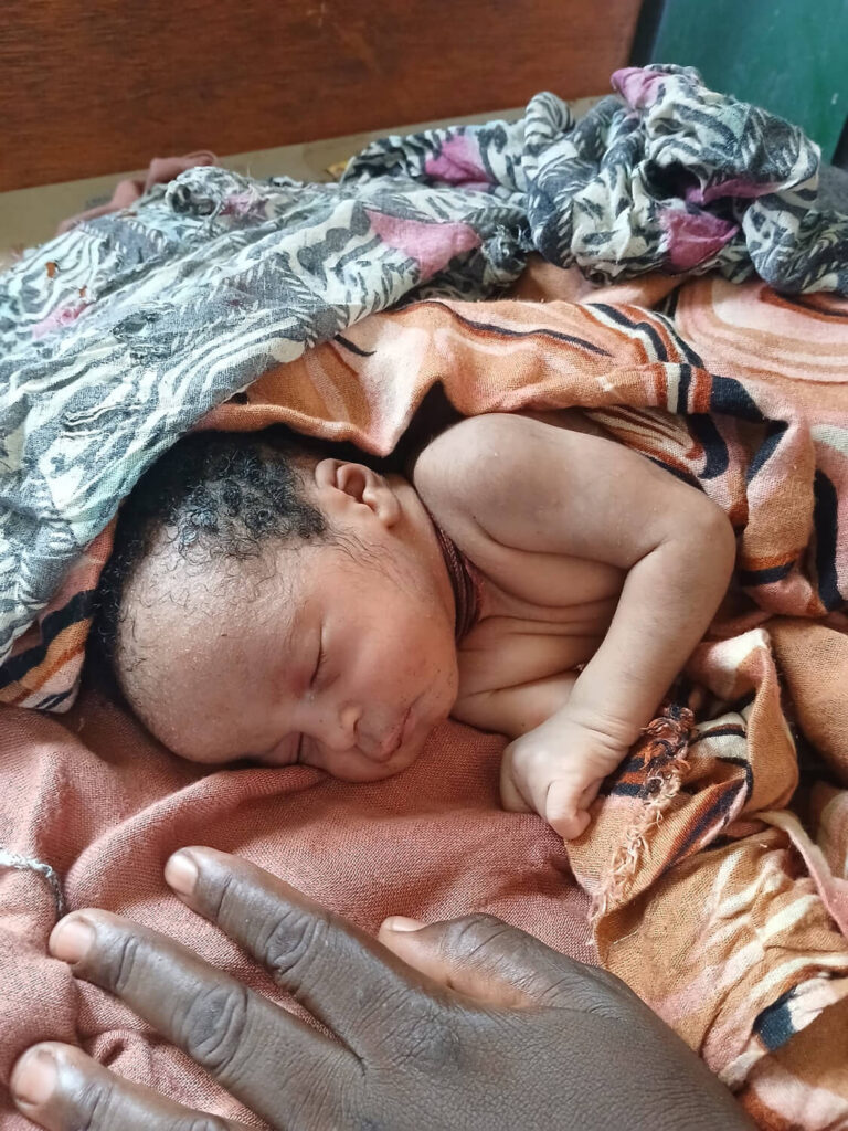 Omran resting in bed after being treated by International Medical Corps’ team at Shangil Tobaya Hospital.